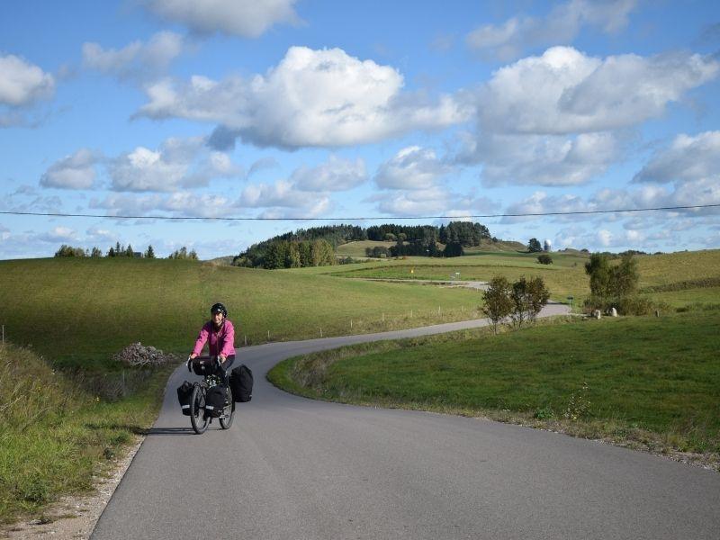 Cyclists riding the Green Velo route through flat Podhale region in Poland.
